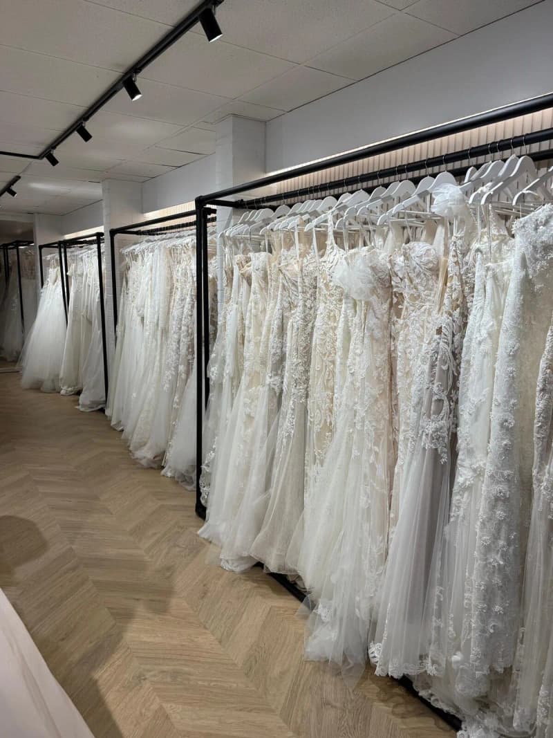 Rails of designer wedding dresses and herringbone floors inside the Cleveleys boutique